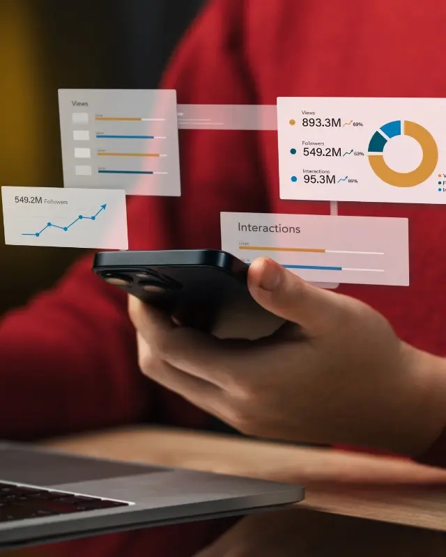 A smartphone surrounded by reporting and graph visuals, representing the reporting services Christy offers